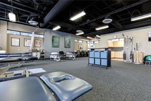Interior of a physical therapy clinic in Glendale, AZ, featuring an open space with exercise equipment